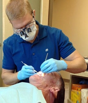 Dentist performing general check up on a patient